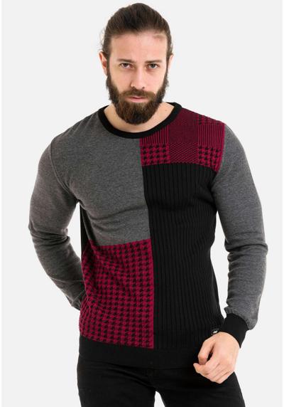 Вязаный свитер модного вязаного вида.