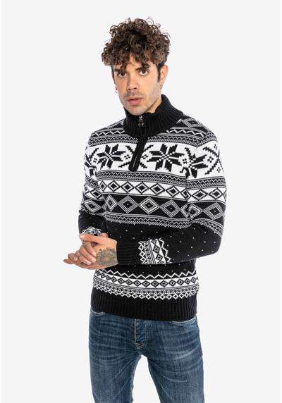 Вязаный свитер с модным норвежским узором.
