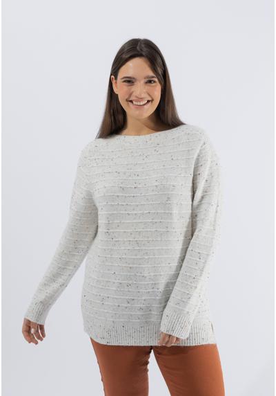 Вязаный свитер слегка точечного дизайна.